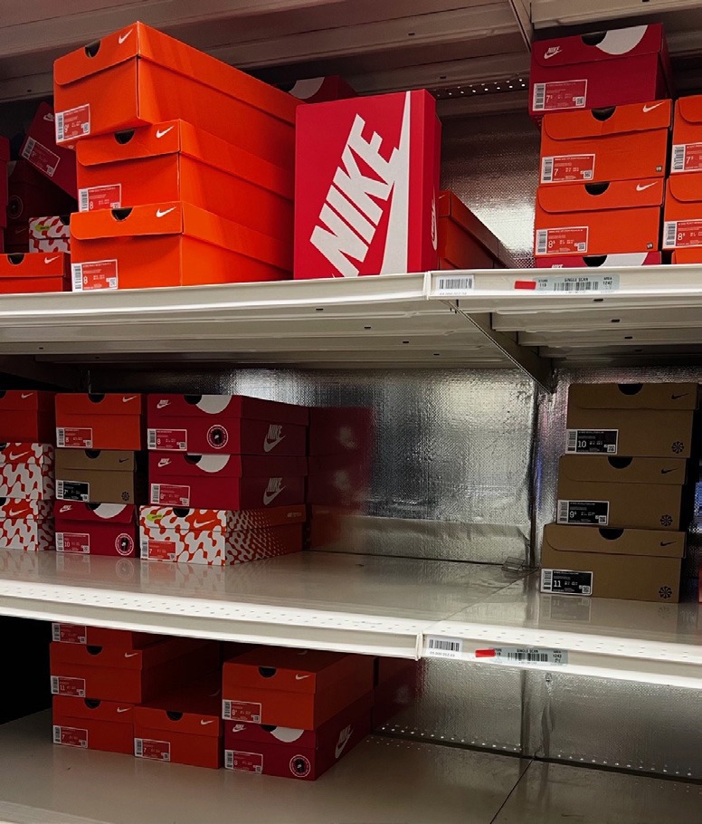 Retail inventory shelves with RFID-tracked products