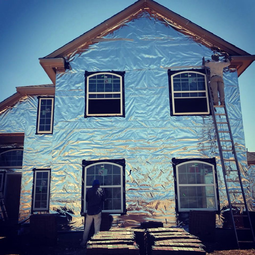 ECO-Shield-Blanket reflective barrier installed on a home exterior